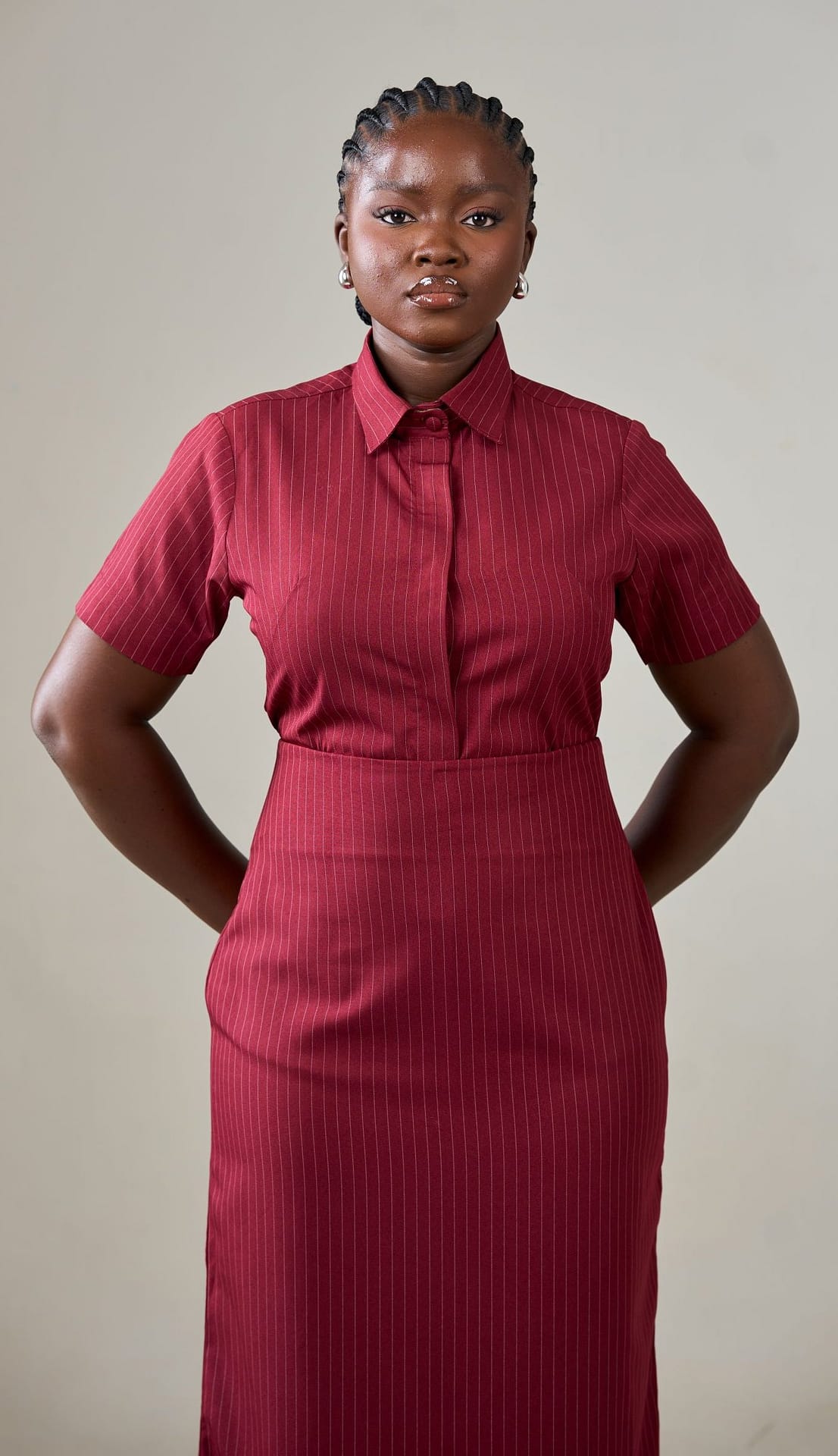 Nuna 3-IN-1 Skirt Model wearing Nuna 3-in-1 Skirt Set — short-sleeved shirt, matching skirt, and detachable belt in burgundy.